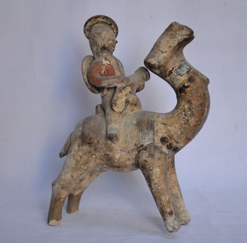 Dromedary and rider in terracotta.