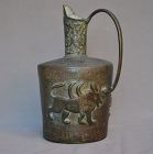 Bronze ewer inlaid with gold wires. Persia.