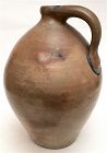 Antique ovoid stoneware jug with cobalt accents