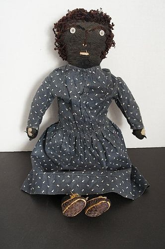 Antique black cloth rag doll with embroidered face