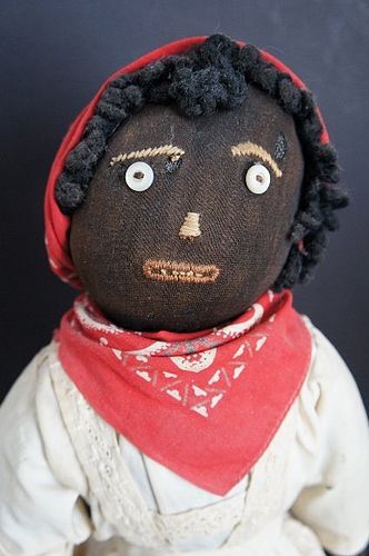 Black cloth bottle doll with great embroidered face and clothes