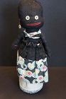 Outrageous and so folky black bottle doll 14"
