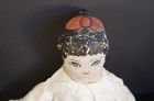 26" painted face doll with a fabulous red bow on the top of her head