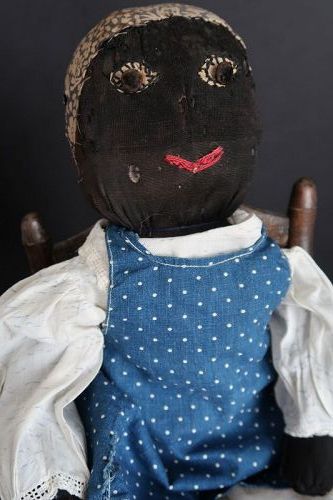 Darling homemade country doll, big button eyes and dressed to play