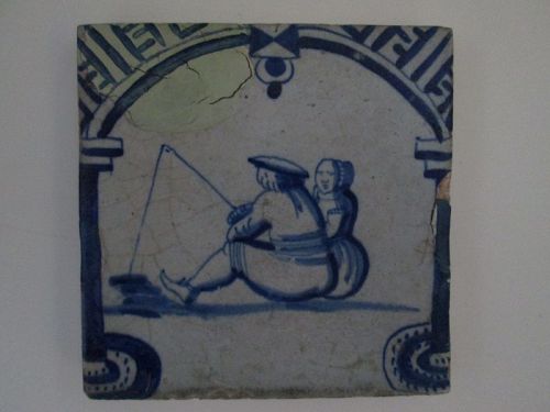 Dutch delft blue and white archway tile c. 1640 of a man with a woman