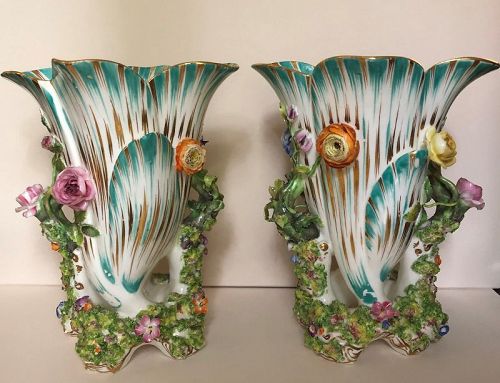 A pair of Coalport floral encrusted vases English c. 1830