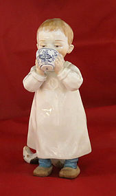 Meissen Figurine of Boy with Cup and Toy Horse