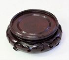 Chinese carved Hardwood round brown display Stand, "Hong Kong" labeled