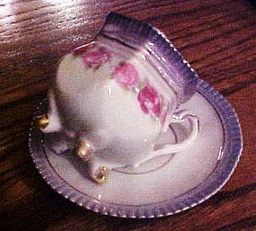 Antique Germany 4 leg teacup and saucer set with lustre trim and roses