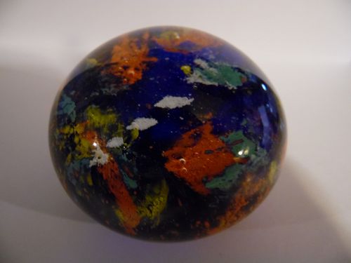 Multi color coral reef glass paperweight.