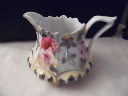 RS Prussia hand painted creamer ornate with 8 feet circa 1800's