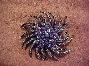 Twisting starburst purple aurora rhinestone pin