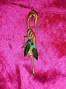 Stork pin with emerald green stones