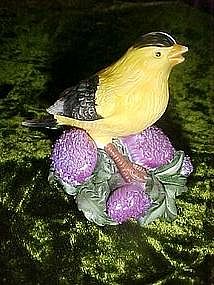 American Goldfinch bird figurine on thistles