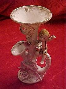 Old porcelain horn vase with cherub and roses