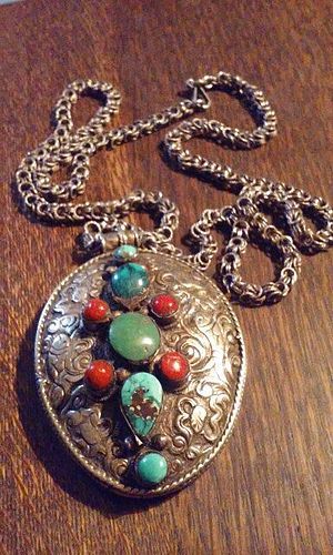 Tibetan Silver Repousse Buddhist Pendant with Turquoise and Coral