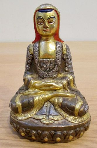 Tibetan Gilt Copper Repousse Seated Figure of Arhat